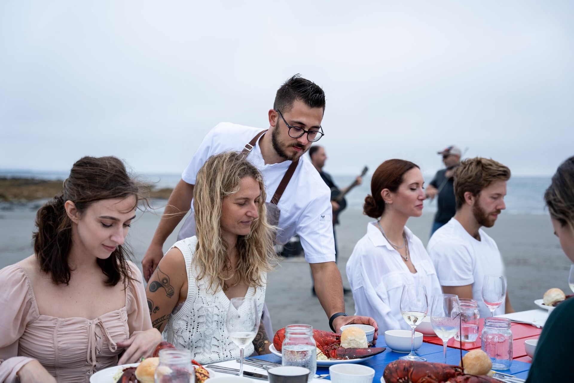Shane Robicheau of Ptit Robicheau serves guests at a Dine on the Ocean Floor event.